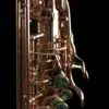 A close up of the side of an alto saxophone
