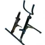 A black stand with two guitar stands on it