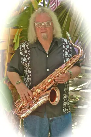 A man holding a saxophone.