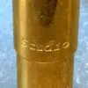 A close up of the side of a gold pen