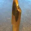 A close up of the tip of a gold pen
