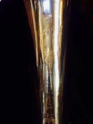 A close up of the bottom of a beer glass
