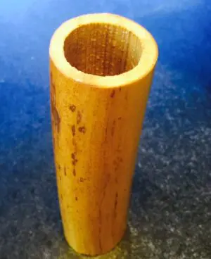 A close up of the side of a wooden tube