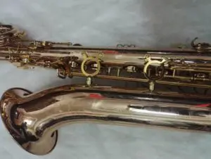 A close up of the side of an old saxophone