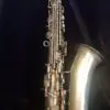 A saxophone is shown with the bottom of it.